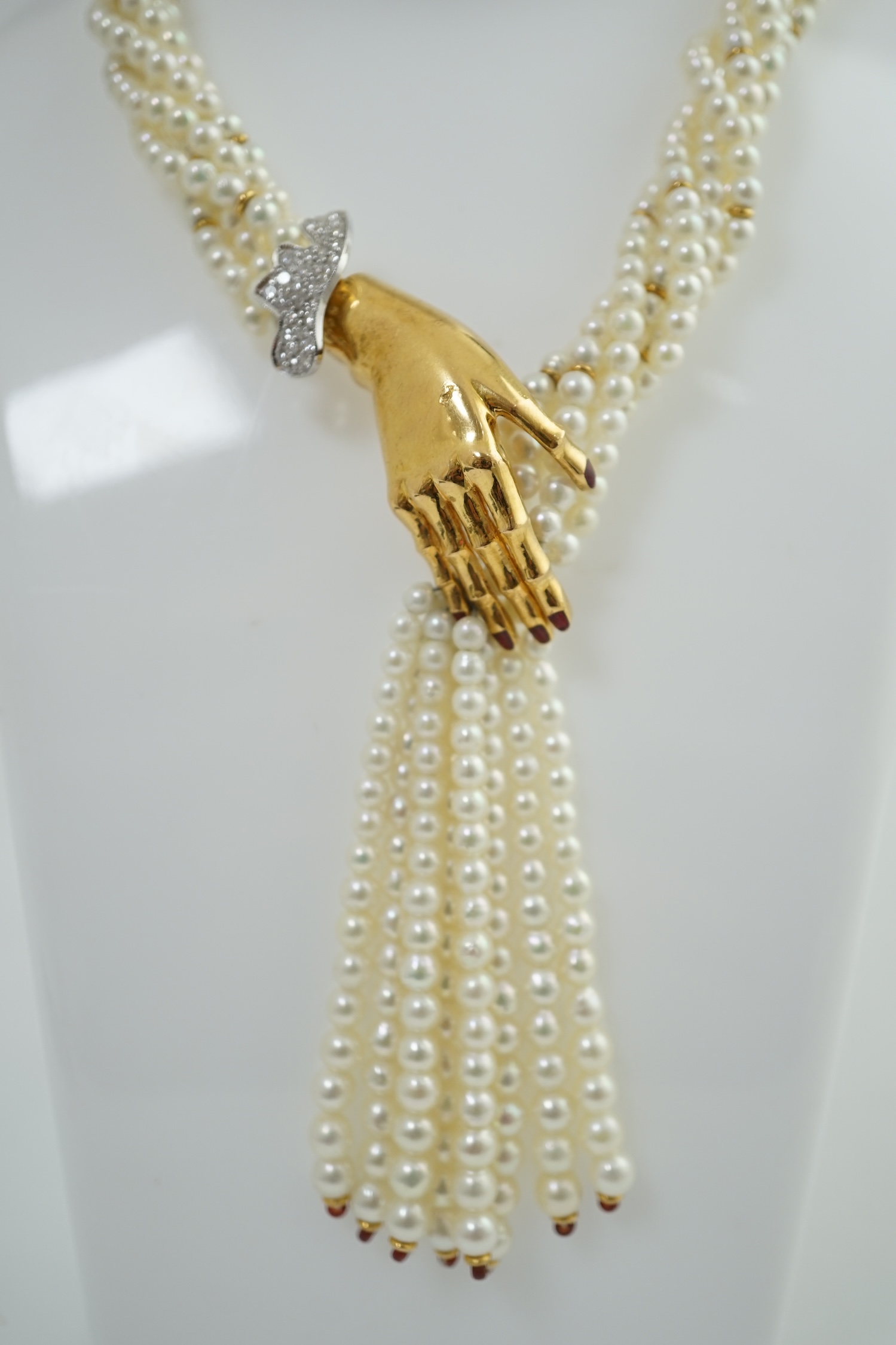 A modern cultured pearl torsade necklace, with gold and diamond cluster set hand clasp